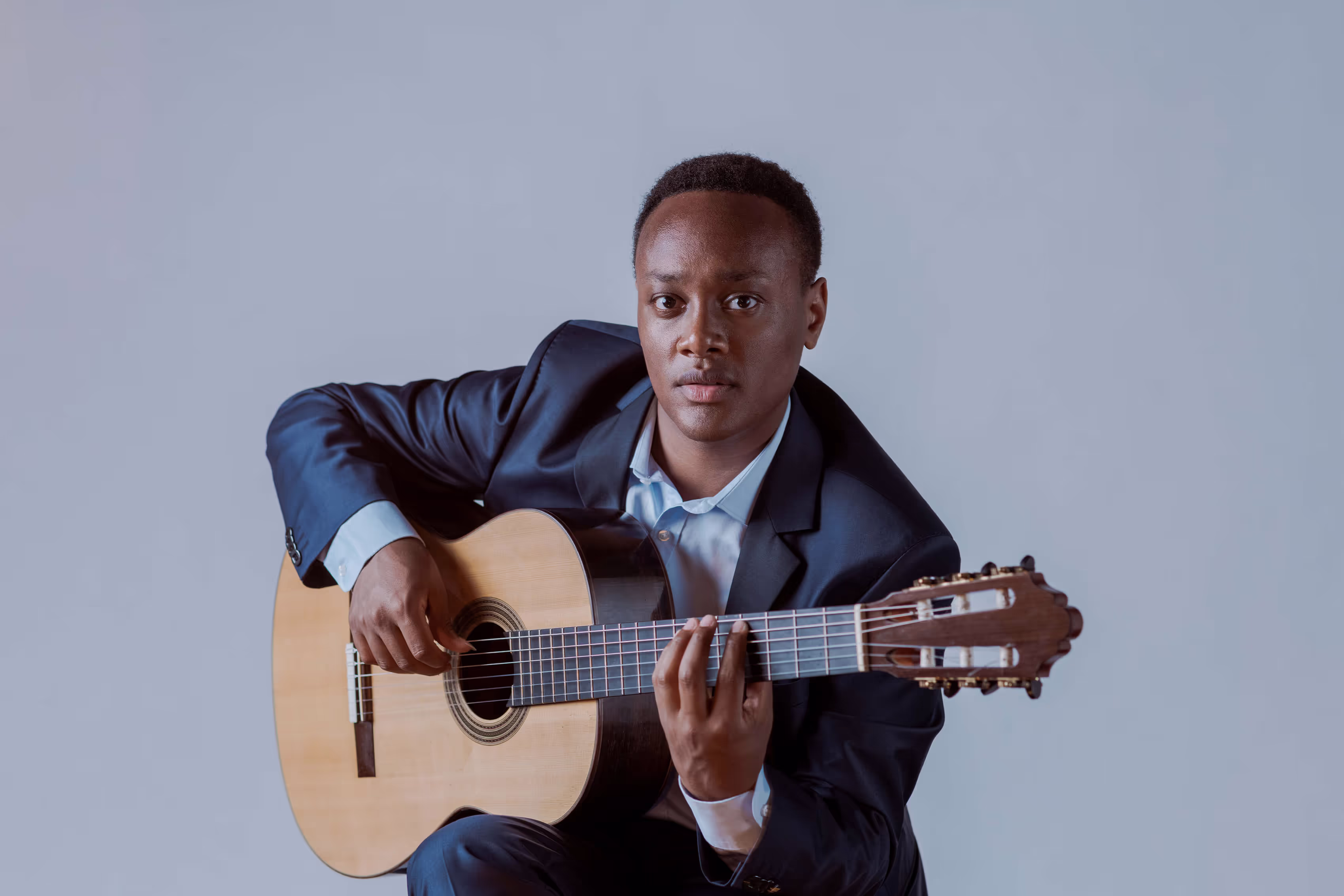 Portrait of Raphaël Feuillâtre with his guitar